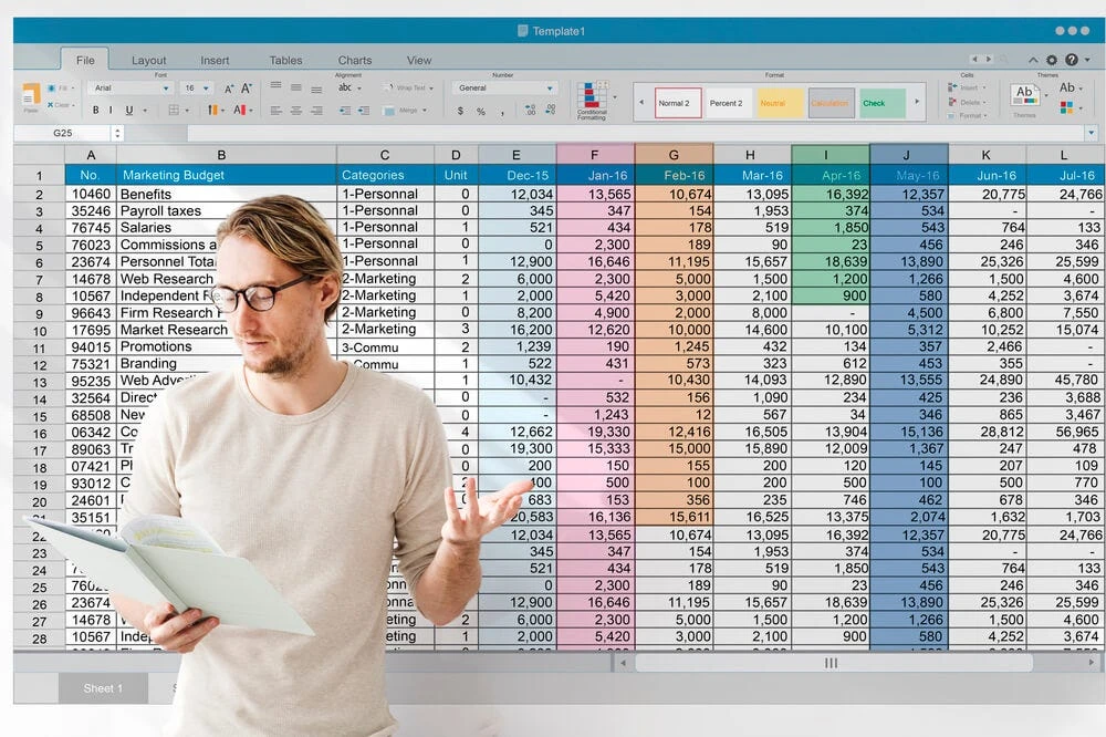 Man in glasses analyzing a spreadsheet with digital marketing KPIs like 'Marketing Budget' and 'Web Research' expenses.