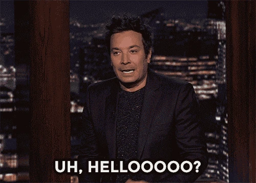 Jimmy Fallon speaking on a dimly lit set, with the text 'UH, HELLOOOOO?' at the bottom.