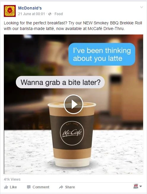 A McDonald's Facebook ad for breakfast with a McCafé latte cup and chat bubbles, demonstrating engaging ad copy.