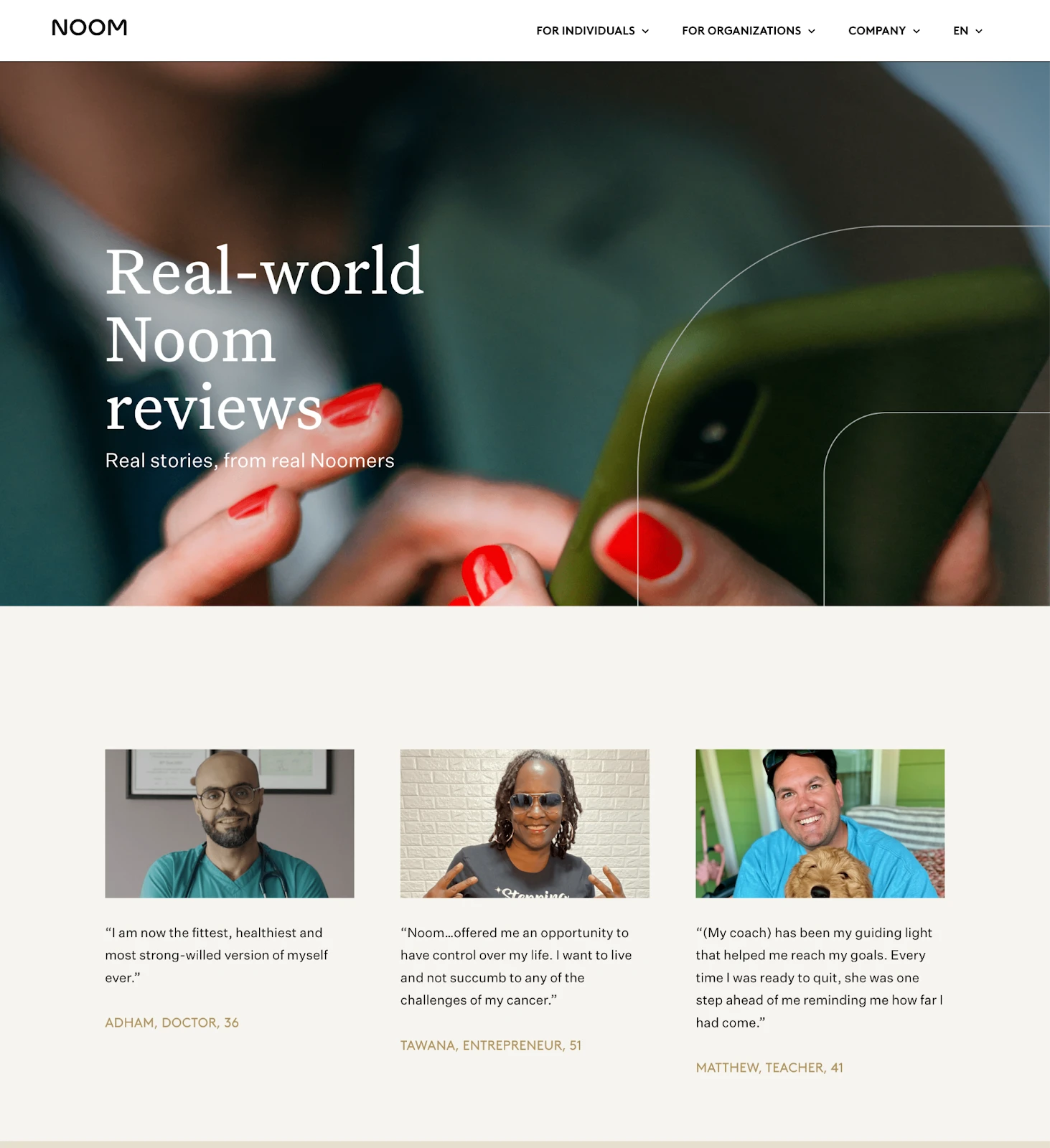 A woman with red nail polish scrolls on a smartphone, illustrating how optimism bias drives engagement with positive reviews.