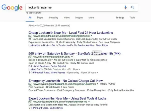 Google search results page showing multiple Google Ads for 'locksmith near me', demonstrating how to see competitors Google Ads.