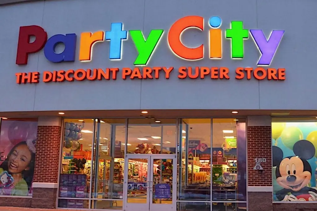 Exterior of a Party City store, a prime example of seasonal marketing with bright signs and window displays.