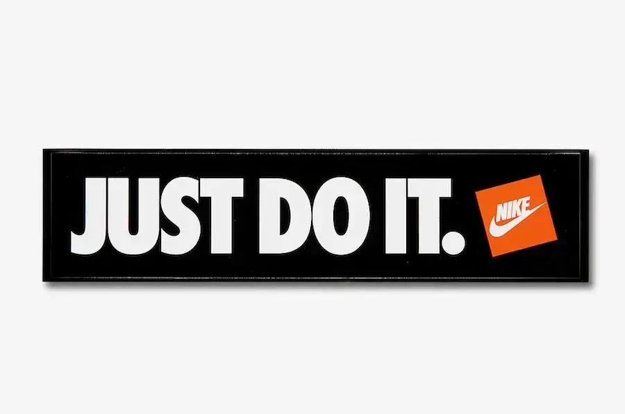 Classic Nike "Just Do It." slogan in white text on a black background, with the orange Nike logo. An example of leveraging the self enhancement bias.