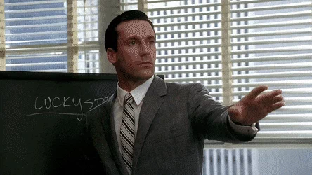 a gif featuring a scene from mad men, illustrating a marketing tactic related to the perceived scarcity effect, where urgency is created to drive consumer action.